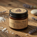 Athleta Christi whipped magnesium cream jar on a wooden surface with lavender flowers.