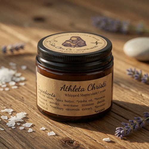 Athleta Christi whipped magnesium cream jar on a wooden surface with lavender flowers.