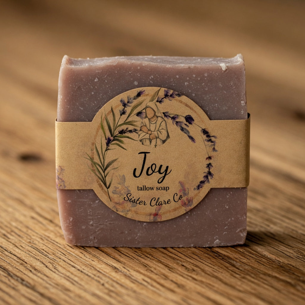 Bar of soap with a brown label on a wooden surface