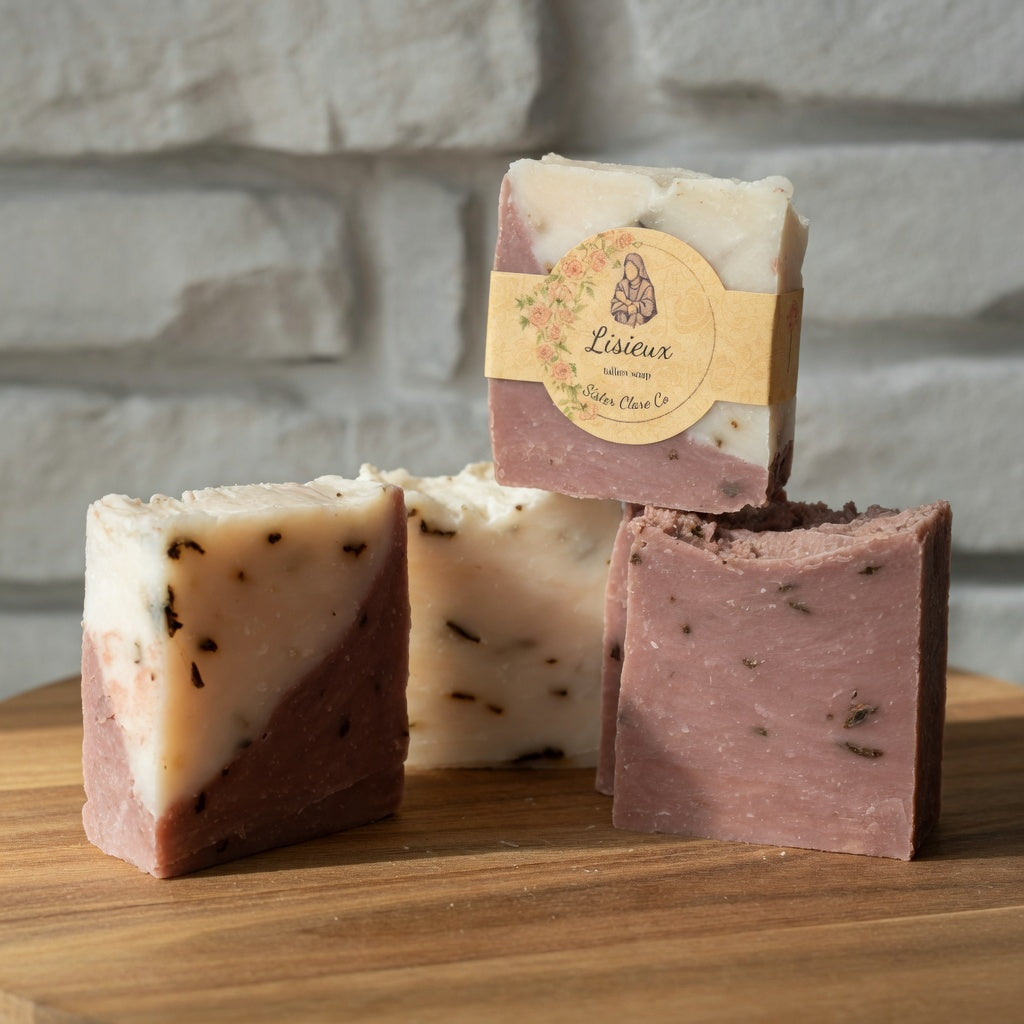 LISIEUX rose tallow soap bar hero shot on warm wooden surface, showcasing beautiful red and white marbling with circular nun logo label, natural lighting