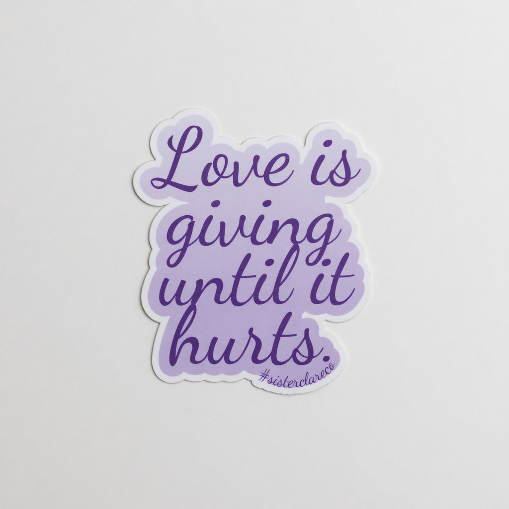 Exact 2-inch 'Love is giving until it hurts' Sister Clare Crockett die-cut sticker on clean background at true-to-life 2-inch physical scale, perfect proportions preserved, no alterations.