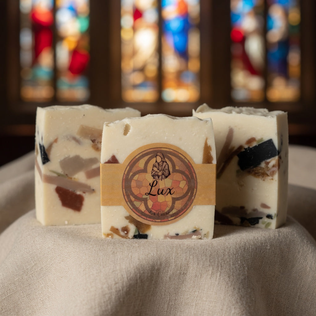 Close-up of Lux Tallow Soap texture on soft linen fabric, highlighting the creamy base and colorful embedded shards exactly as in the reference photo.