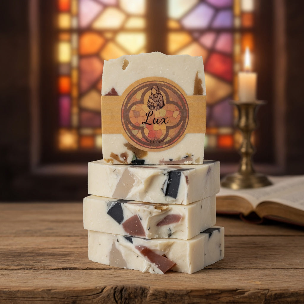 Stacked Lux Tallow Soap bars on natural surface, focusing on the marbled stained glass pattern and labels.