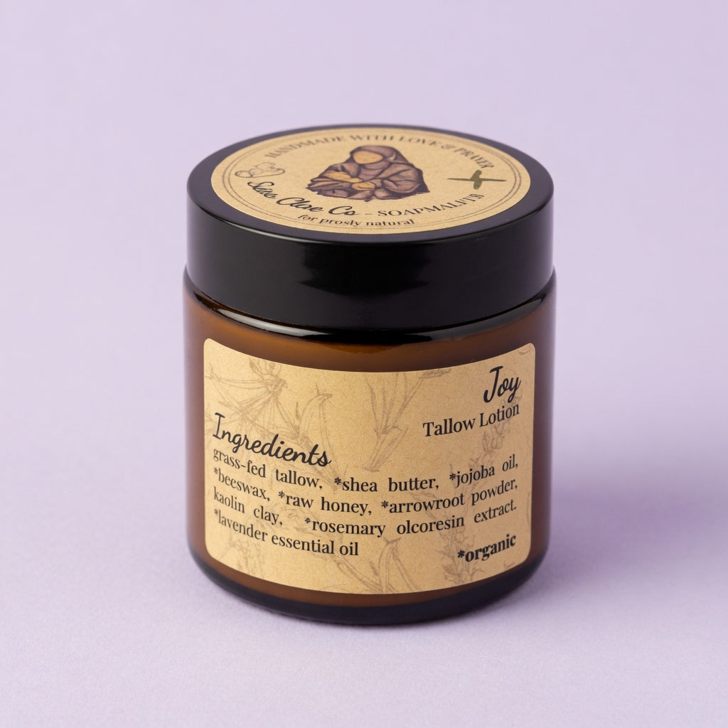 Single jar of Joy Tallow Lotion elegantly displayed against a soft light lavender background for a joyful and feminine feel