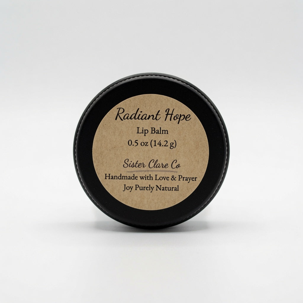 A round black tin of Sister Clare Co Radiant Hope Lip Balm, featuring a kraft paper label, set against a clean white background.