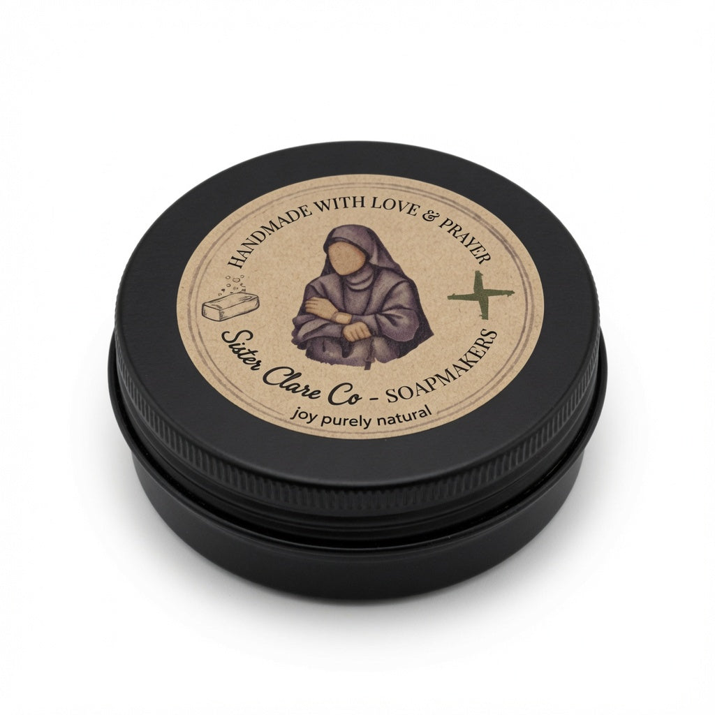 Black tin with a label featuring a religious figure, likely a nun, on a white background.