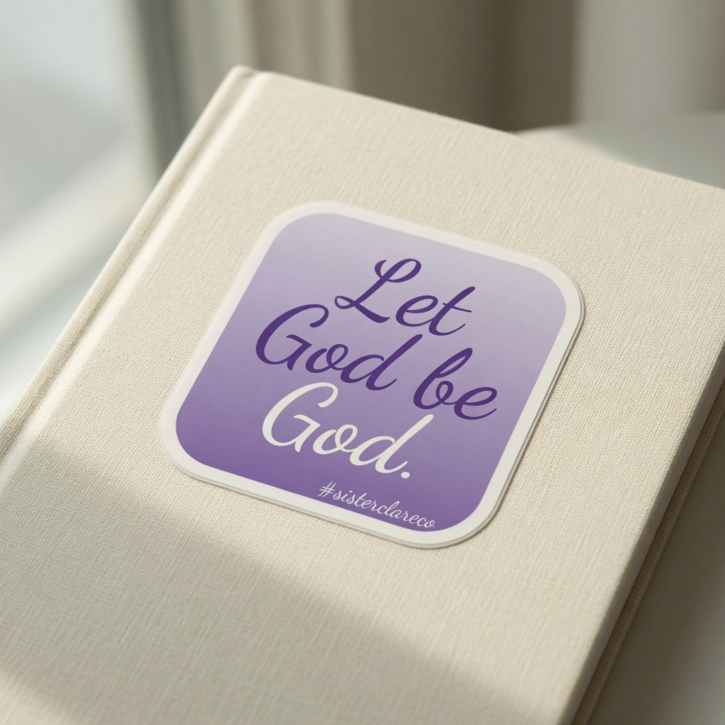 Exact 2-inch 'Let God be God' Sister Clare Crockett sticker in use on notebook at true-to-life 2-inch physical scale, no changes to sticker words or colors.
