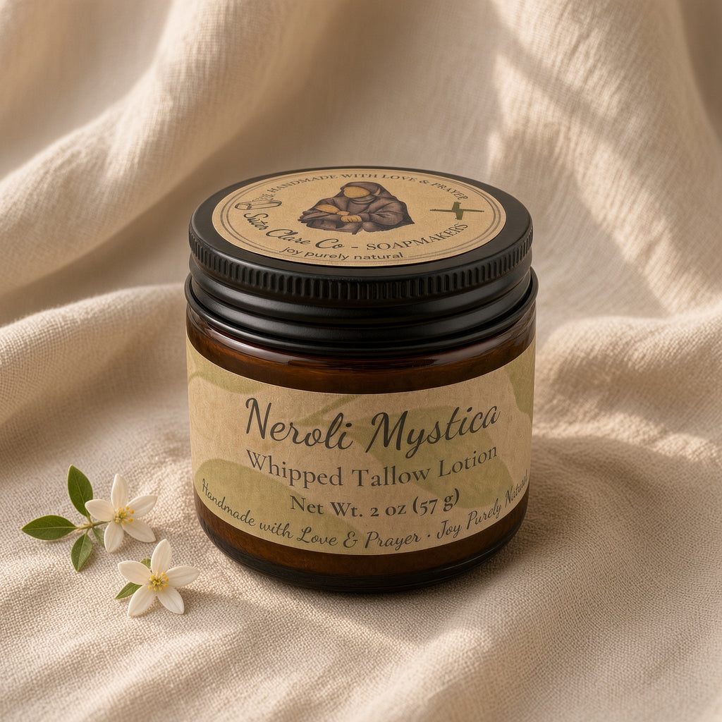 Neroli Mystica whipped tallow lotion jar on linen with blossom, three-quarter light